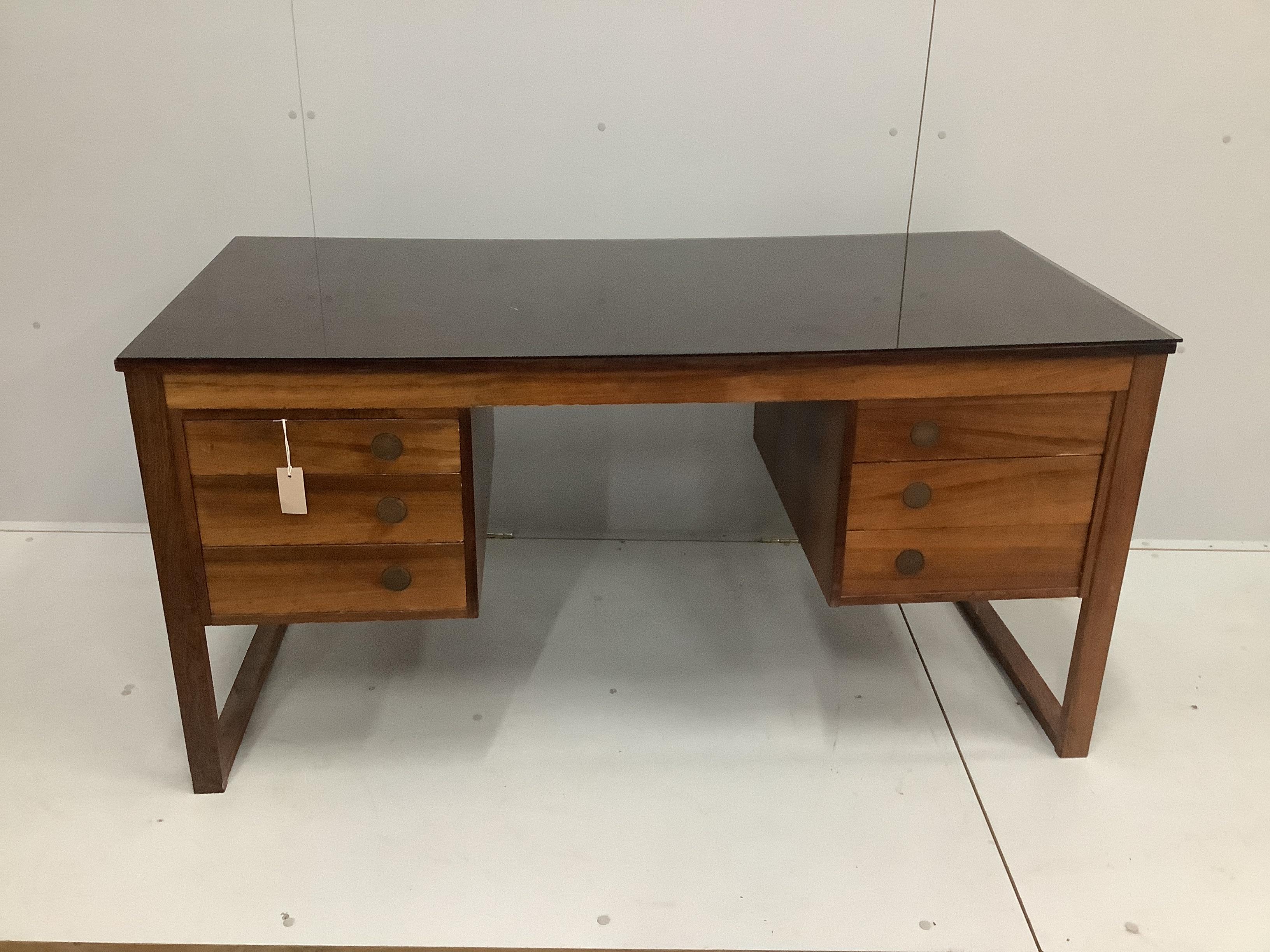A mid century Danish Dyrlund Indian rosewood kneehole desk, width 145cm, depth 69cm, height 72cm